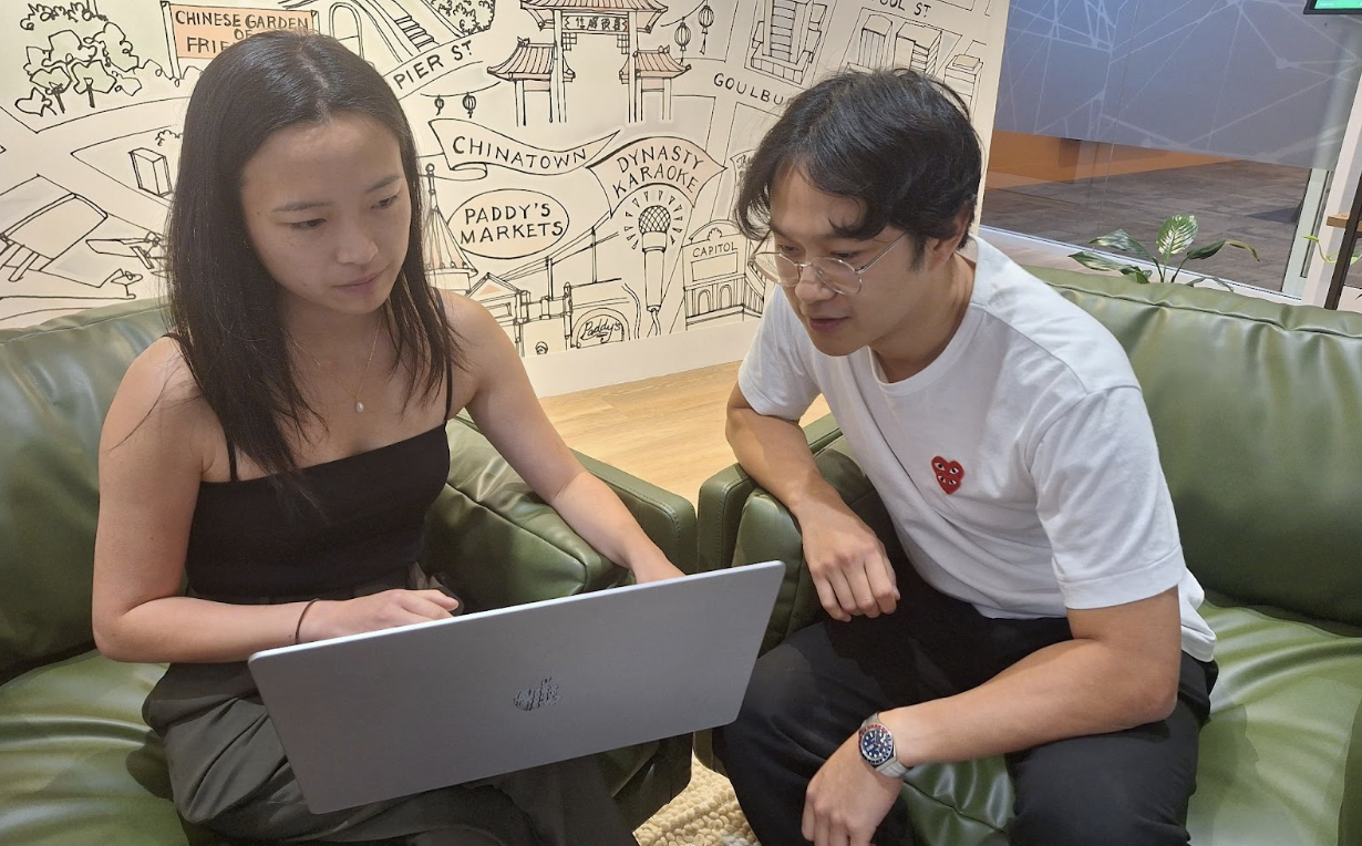 Photo of Lavendar and Angus working together in the office